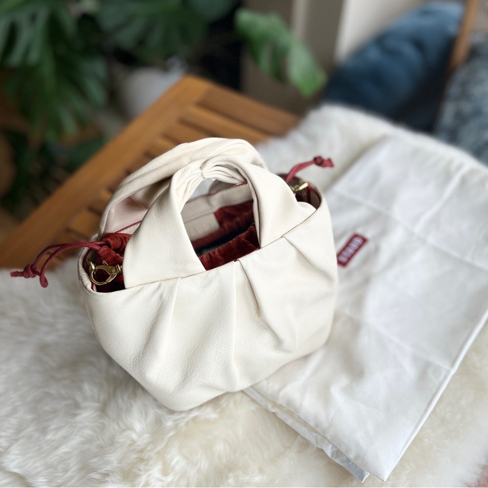 Staud Lera handbag in cream comes with a cross body chain